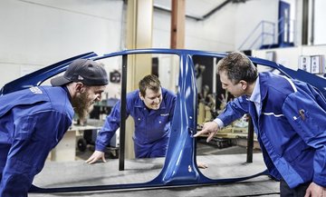 BENTELER Automotive employees working on car body shell 